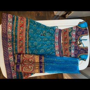 Indian outfit: Lengha/chaniya, choli and dupatta (skirt, top and scarf).